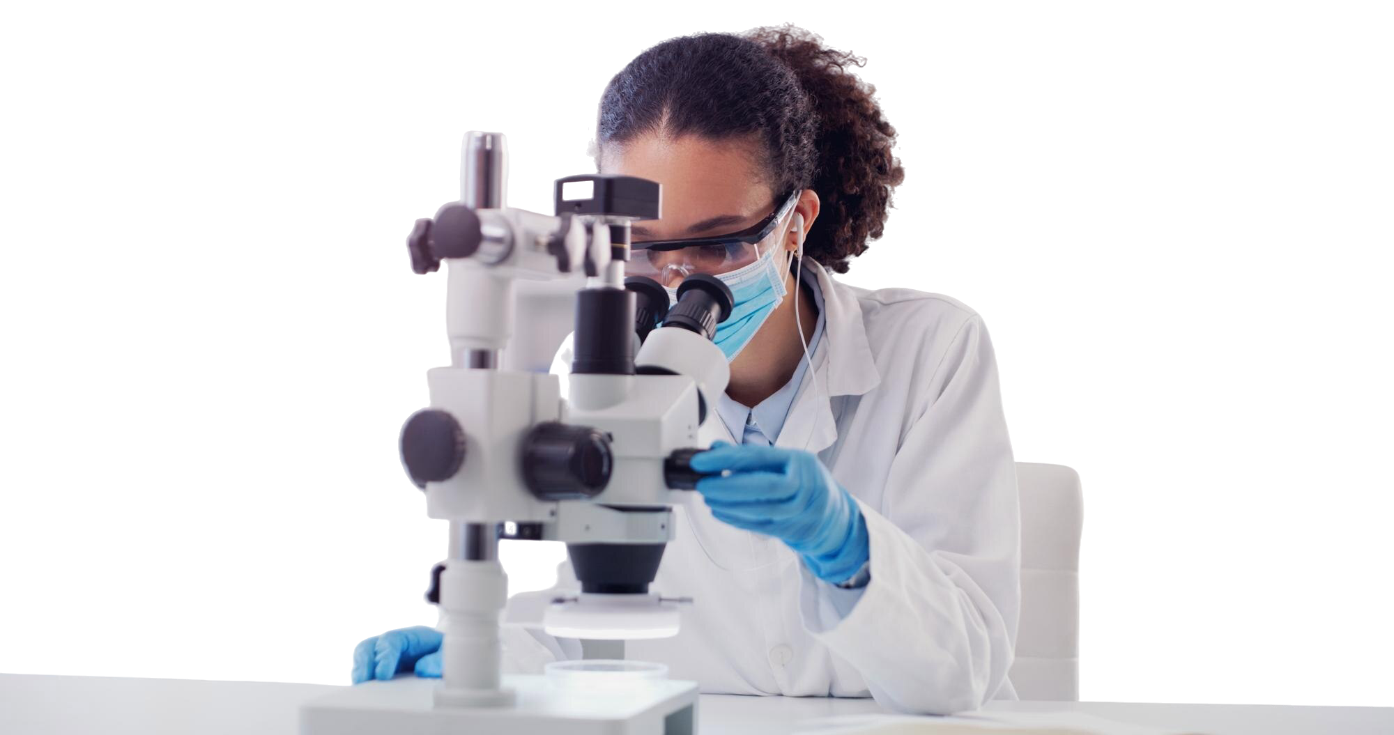 Female scientist conducting cancer research with microscope in laboratory